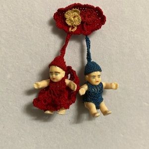 Vintage crochet babies on a safety pin